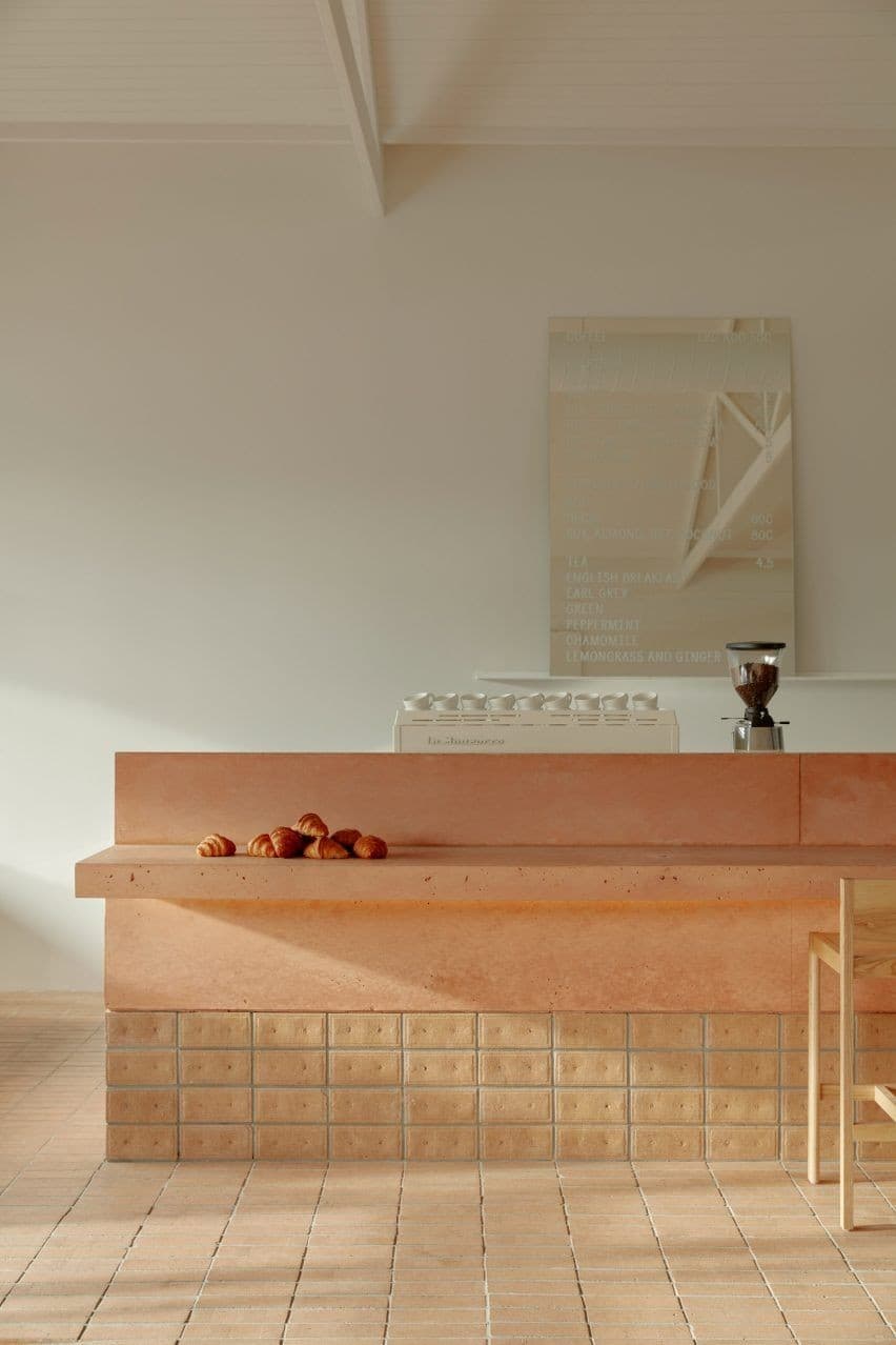 Bean cafe interior with croissants and coffee